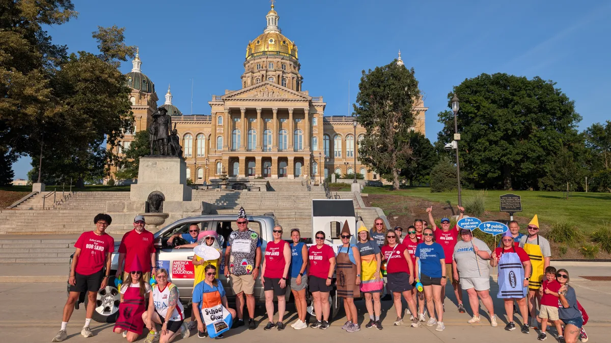ISEA members stand in front of the Iowa Capitol Building during the Iowa State Fair Parade.