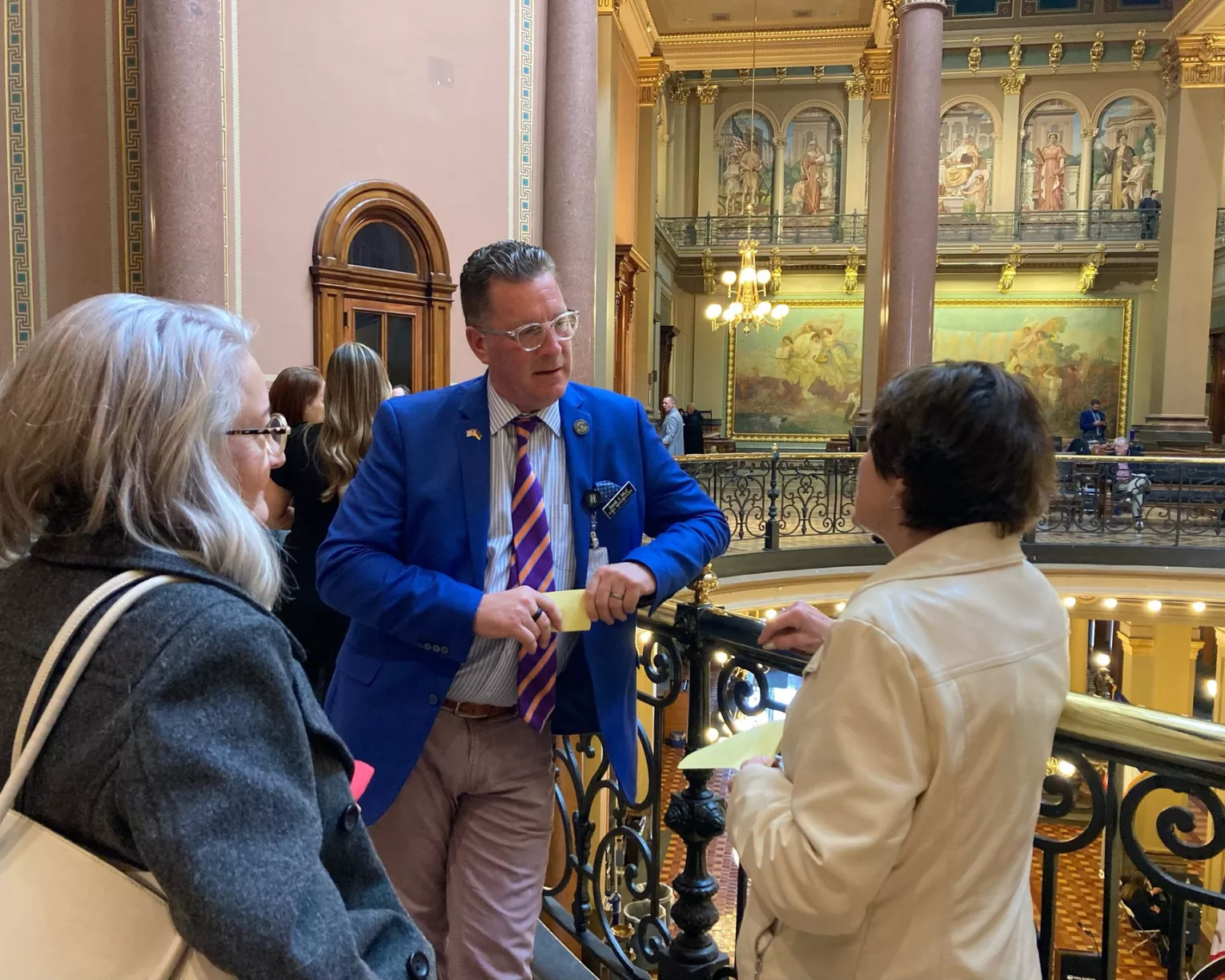 ISEA members talk with a legislative staffer in the state capitol building